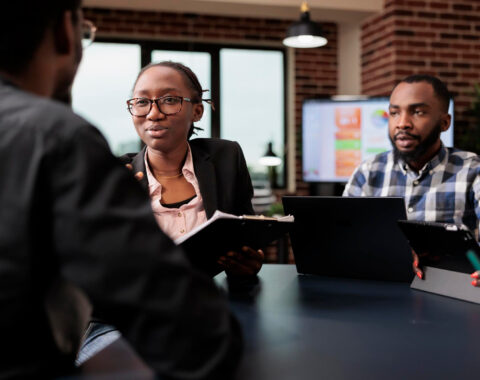 colleagues-team-working-company-paperwork-doig-teamwork-analyze-documents-online-research-information-planning-corporate-presentation-with-data-charts-job-collaboration