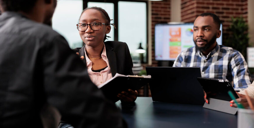 colleagues-team-working-company-paperwork-doig-teamwork-analyze-documents-online-research-information-planning-corporate-presentation-with-data-charts-job-collaboration